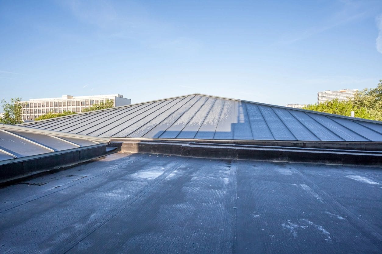 A roof that has been covered in tar paper.